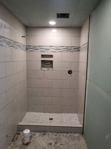 Hard Surface Interiors: Interior construction and remodeling with a specialization in tile and stone, we can transform your space with multiple types of flooring including tile, wood, and epoxy.