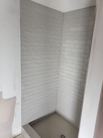 Hard Surface Interiors: Interior construction and remodeling with a specialization in tile and stone, we can transform your space with multiple types of flooring including tile, wood, and epoxy.